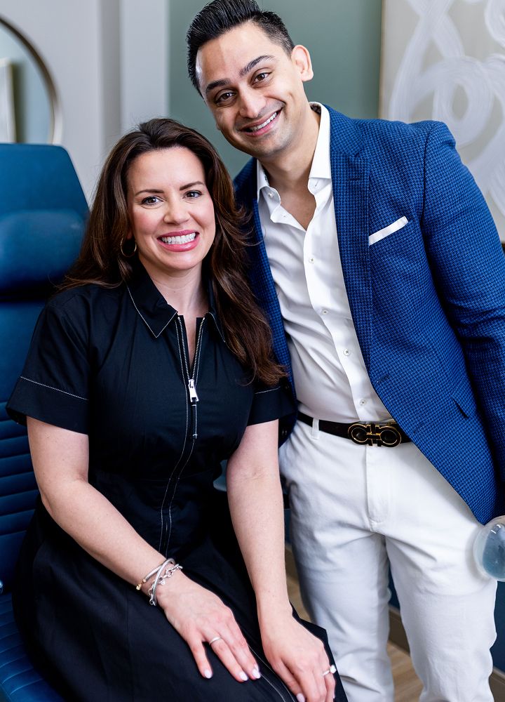 Smiling professionals in a modern office setting.