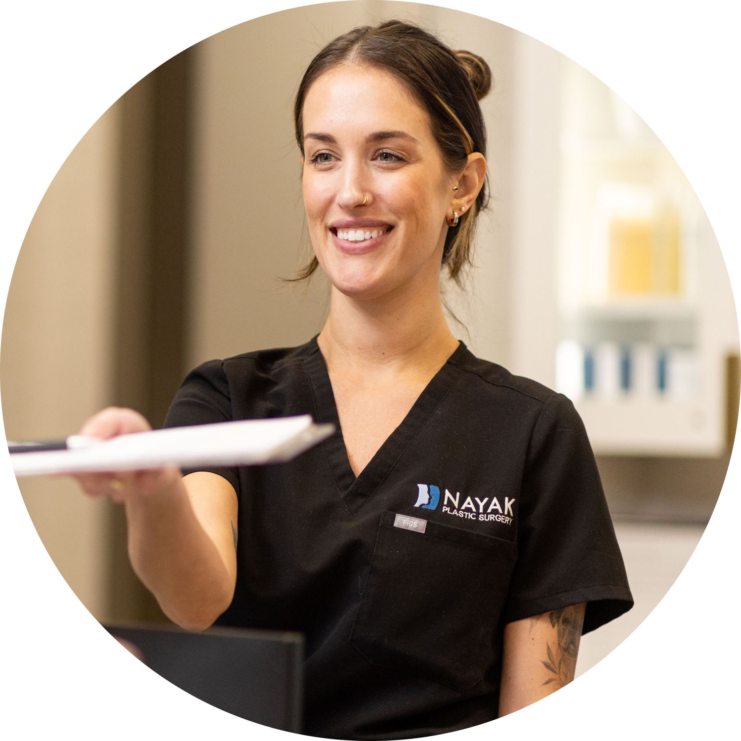 Smiling professional at a plastic surgery office.