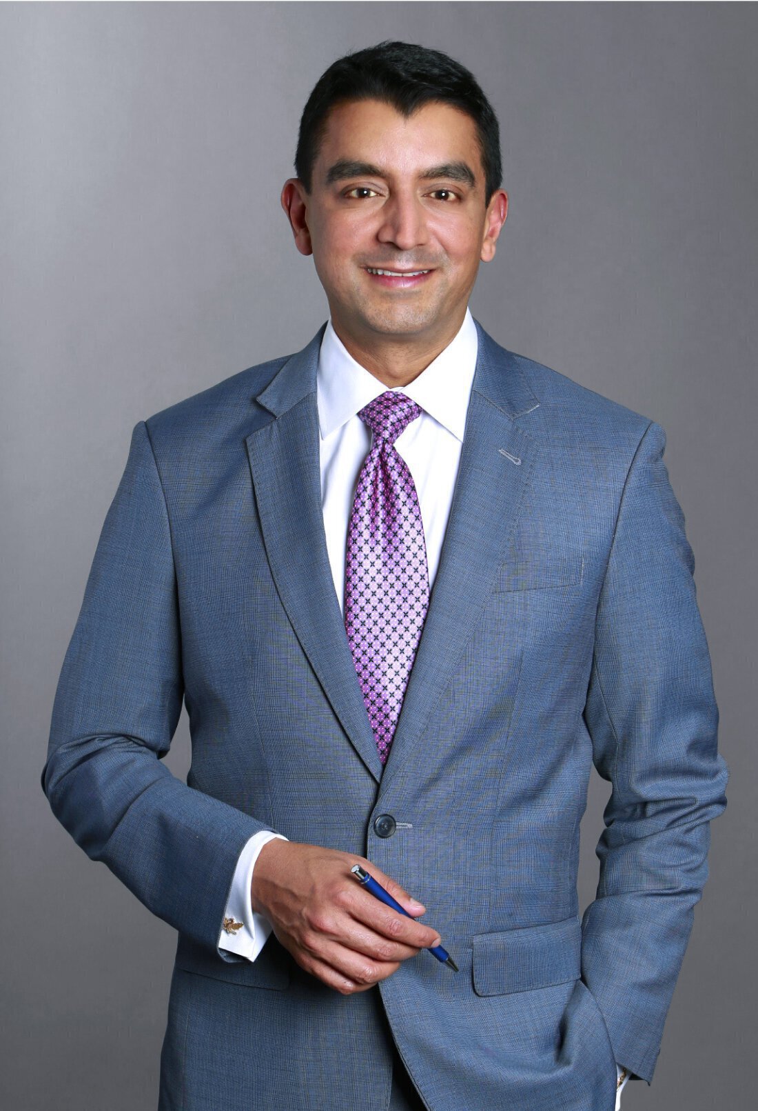 Dr. Nayak of St. Louis Plastic Surgery in a suit